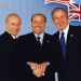 con Vladimir Putin e George W. Bush (2002)